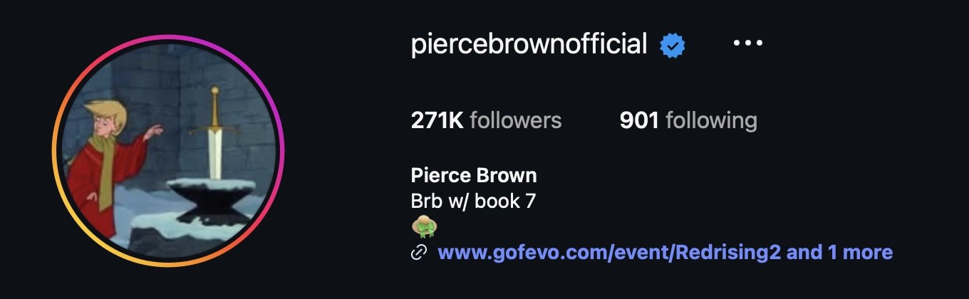 Pierce Brown’s verified Instagram profile displaying “Brb w/ book 7” and a hat emoji.